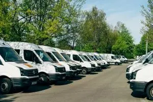 A fleet of commercial vehicles parked together.