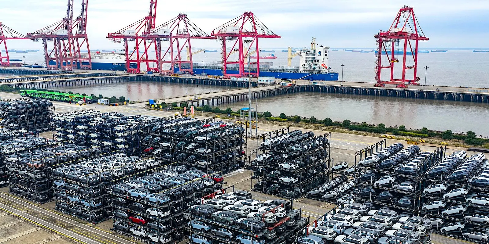 Used Chinese EVs at port, on their way to Europe and Canada at 40% off