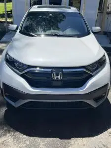 Front view of a white Honda CR-V after storm damage repair at SQR One Coll1sion in Cabot, Arkansas