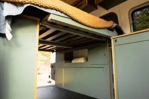 Timber Van Kits Wheel Well Cabinet and Bed System in Slate Green